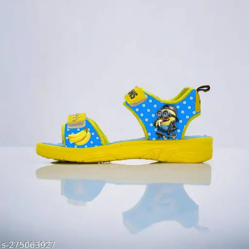 Yellow and Blue Minion-themed kids sandals in patent leather, ideal for Despicable Me fans. Fun cartoon character pattern." (124 characters)