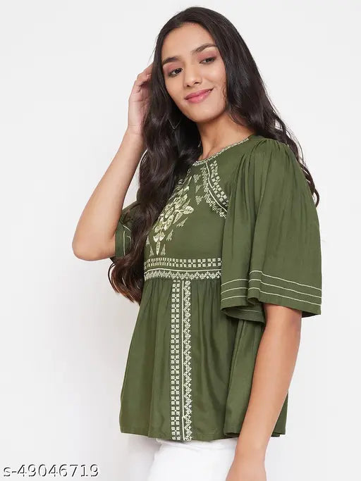 WineRed green embroidered rayon A-line top on hanger, ideal for office and casual wear. Soft against skin, perfect for a day or night out with flared bottom and matching accessories." (103 characters)