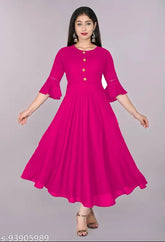 Trendy pink rayon flared kurti, 3/4 sleeve length, solid pattern for women's casual and formal wear. Hand wash or machine wash care