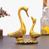 Gold brass pair of kissing swan statues for home decor, featuring a spiritual design of love birds. Vastu-friendly figurine with a length of 5 cm, height of 12 cm, and breadth of 7 cm. Handmade in India