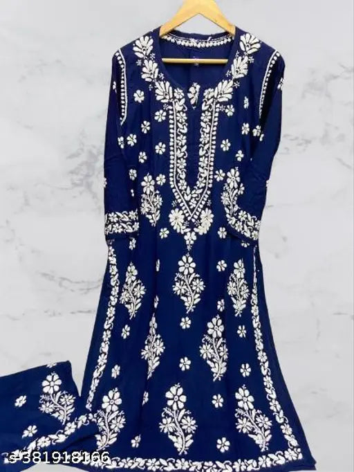 Embroidered rayon Chikankari work kurti and palazzos set, three-quarter sleeves, Indian traditional clothing on display