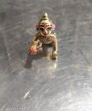Blue-eyed pure brass Krishna idol, traditional Indian religious figurine