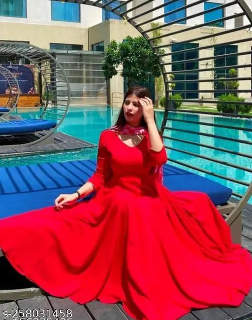 Solid red rayon Anarkali kurta with attached dupatta, elegant and flattering for festive occasions. Made in India