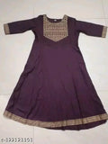 Maroon flared rayon kurti with intricate gold print, perfect for casual or festive occasions