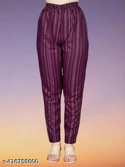 Deep purple rayon women's kurta palazzo set with elasticized waistband, three-quarter sleeves, and intricate embroidery detailing. Indian origin." (124 characters)