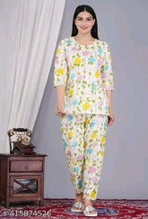 Multicolor cotton printed night suit top & pyjama coord set for women, featuring three-quarter sleeves and a vibrant print. Made in India