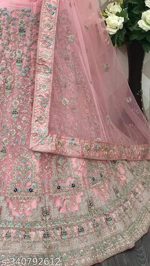 Heavy pink net lehenga choli with embroidery work, semi-stitched blouse and dupatta. Ideal for festive occasions - Indian party wear