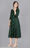 Green Rayon Saavi ARJ 2 Bottel blouse with three-quarter sleeves, printed combo design. M size bust 38in, L size bust 40in. Indian fashion wear on mannequin