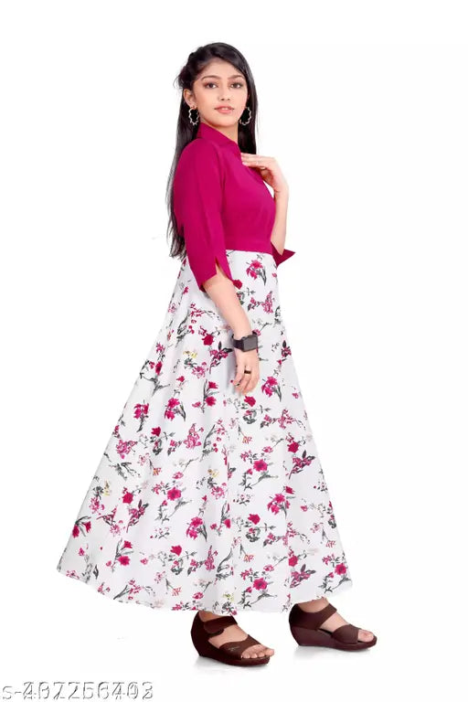 Pink printed maxi dress with round neck and flower detail, crepe fabric, suitable for girls 6-15 years old. Indian designer party wear