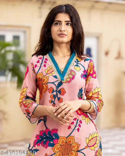 Trendy printed cotton blend kurta & palazzo set by Nirvaan Enterprises, suitable for casual parties, weddings, office wear, lounge, and leisure. Classic neck design in Indian ethnic style