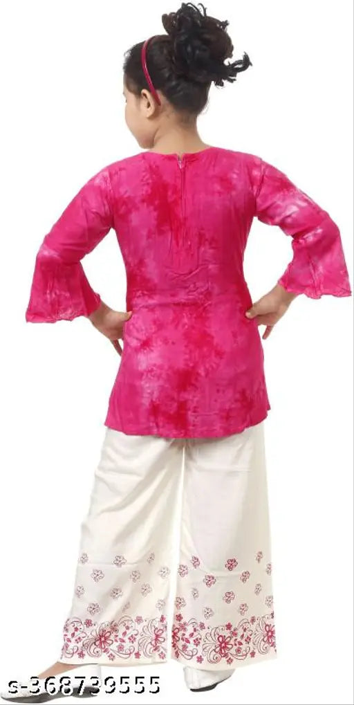 Pink and White Printed Rayon Anarkali Kurti with Palazzo for Women & Girls. A-line top with three-quarter sleeves and calf length, paired with palazzo pants offering comfort and wide legs. Traditional Indian ensemble featuring intricate designs, suitable for various occasions like cultural celebrations or formal events. Available in sizes from 1-2 Years to 9-10 Years, originating from India