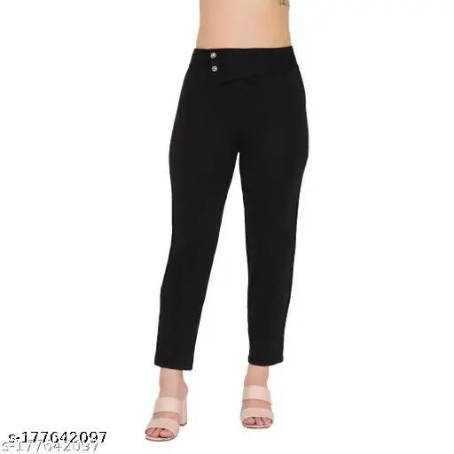 Poly blend solid net ankle length Urbane Modern Women trousers, featuring front detail, elastic waistband, and slim fit. Made in India