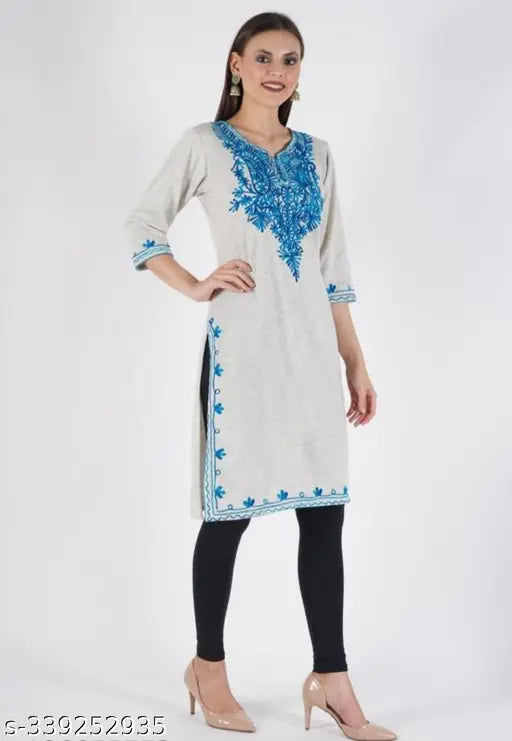 Woolen three-quarter sleeve winter kurti, solid design. Fashionable, comfortable woolen kurti. Made in India." (124 characters)