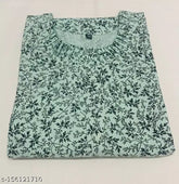 Stylish black printed green cotton kurti with three-quarter sleeves, perfect for women and girls. Indian traditional wear in XL, L, XXL, XXXL sizes