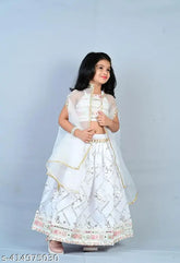 White embroidered Brocade ethnic Lehenga choli for small girls, silk blend top and net dupatta on display. Indian-made traditional kids wear, sizes from 6-8 years
