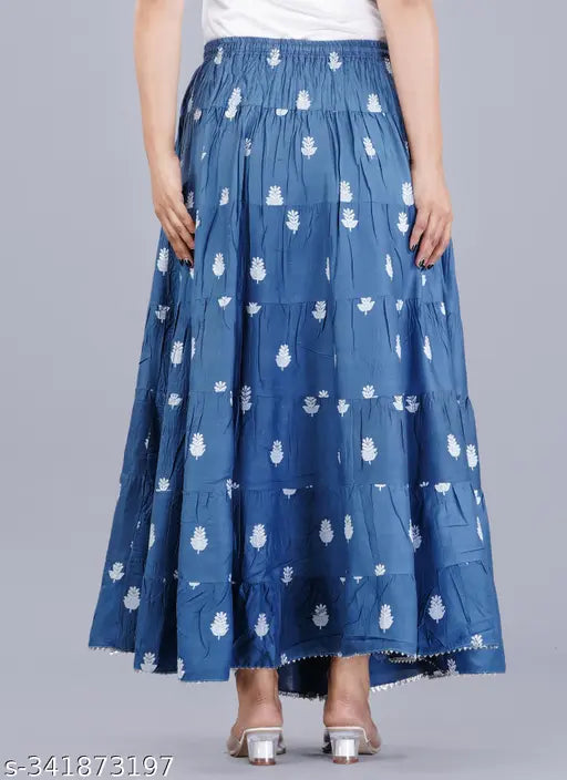 Printed rayon floral tiered skirt with drawstring and tassels, all-over elastic waist band, dori and tassel detailing. Women's long printed skirt in multiple sizes