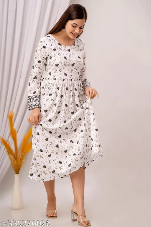 White rayon Anarkali kurtis, long sleeves, printed design for women's casual wear. Lightweight fabric ensures comfort and perfect fit