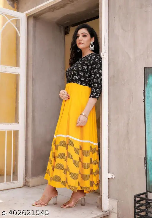 Yellow printed flared rayon kurti with three-quarter sleeves, features vibrant combo pattern. Close-up image showcases women's S-XXXL yellow printed flared kurti from India