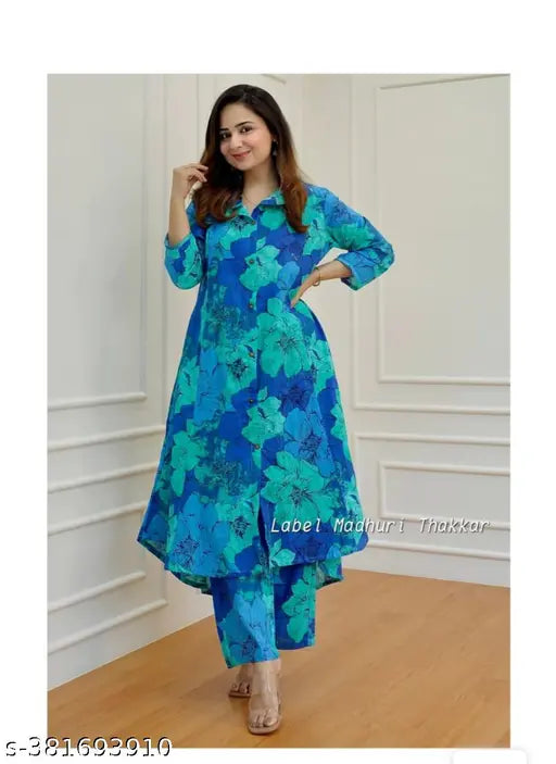 Premium blue cotton kurta set with palazzos, three-quarter sleeves, printed net pattern. Indian women's fashion, premium floral Alia cut kurta and bottomwear