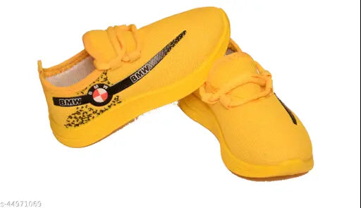 Yellow canvas and PVC kids sports running shoes for all seasons, comfortable and suitable for infants aged 18 months to 4 years, featuring lace-up fastening, padded insole, printed net pattern, and anti-slip wear-resistant sole. Made in India