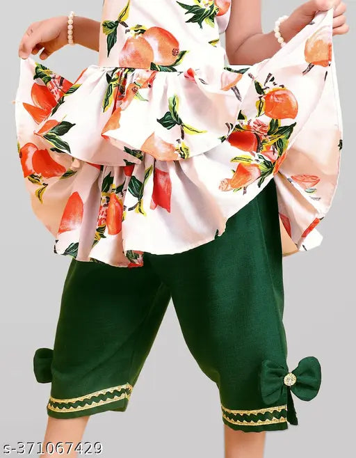 Orange harem pant kurta set for girl from Queenpin Festive Collection, made of cotton. Printed straight top with sleeveless design and A-line dhoti bottoms. Sizes range from 12-18 months to 7-8 years