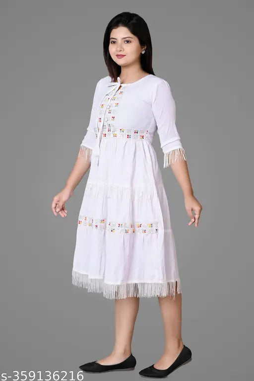 White cotton blend embellished kurta with three-quarter sleeves, rope waist, high quality, comfortable fabric. India origin." (124 characters)