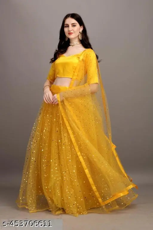 Yellow satin lehenga with embellished net dupatta and unstitched blouse, semi-stitched Indian traditional wear on display