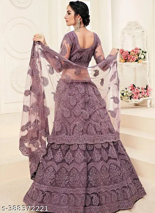 Embroidered Kalidar free size net lehenga choli set with embellished dupatta, traditional Indian wedding attire on mannequin