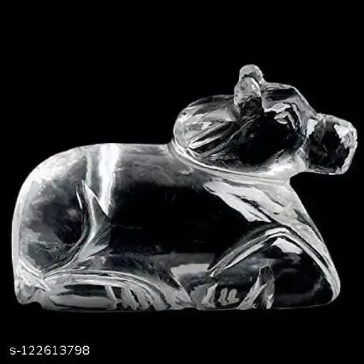 Natural Quartz Crystal Sphatik Nandi statue for Pooja, home decor, or car dashboard. Dimensions: 4.5cm (L) x 3.5cm (H) x 1.5cm (W). Symbolizes strength, wealth, and harmony. Made in India