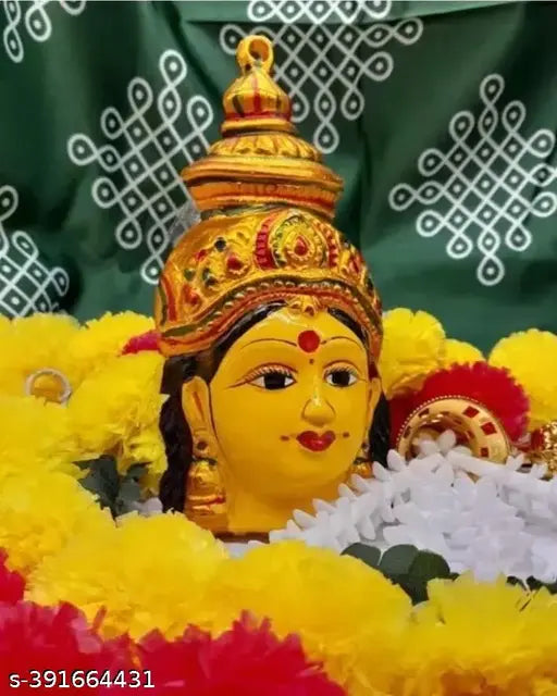Handmade yellow aluminum Yantra showpiece featuring the Ammavari, Varalakshmi, and Gowri faces, commonly used in Indian home decor and spiritual practices