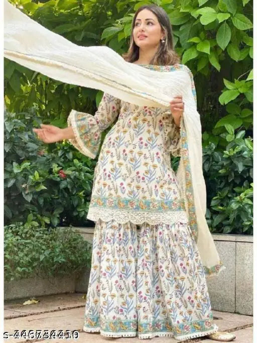 Jaipuri printed kurti sharara dupatta set with rayon fabric, three-quarter sleeves, and vibrant print, model wears size M on mannequin