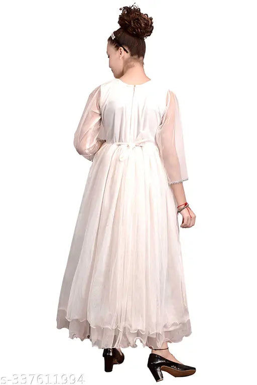 Net girls gown with three-quarter sleeves, suitable for 4-12 years old, by Mtm Enterprises. Ideal for puja, banquet, weddings, travel, and all occasions. Made from advanced quality net, lycra, can can net, and roto fabric, soft and comfortable to wear