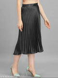 Satin pleated midi skirt, stretchy and trendy for women's western wear. Full-length, elastic waistband, flared hemline. Rich, wrinkle-free satin fabric. Sizes from 28 to free size. Indian origin