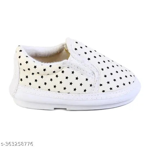 Soft cotton unisex baby shoes with PVC sole, printed check pattern, slip-on design. Comfortable for infants aged 6-24 months. Indian origin