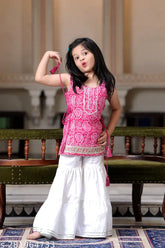 Kiara pink rayon sharara set, sleeveless printed kurta and bottomwear on model