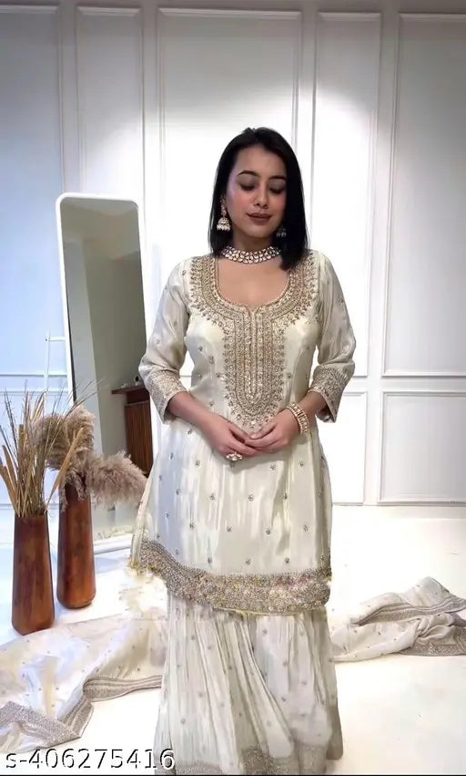 Silk white Chinon replika sharar kurta with dupatta and bottomwear, heavy embroidery sequence work, three-quarter sleeves. Indian handcrafted silk attire on display