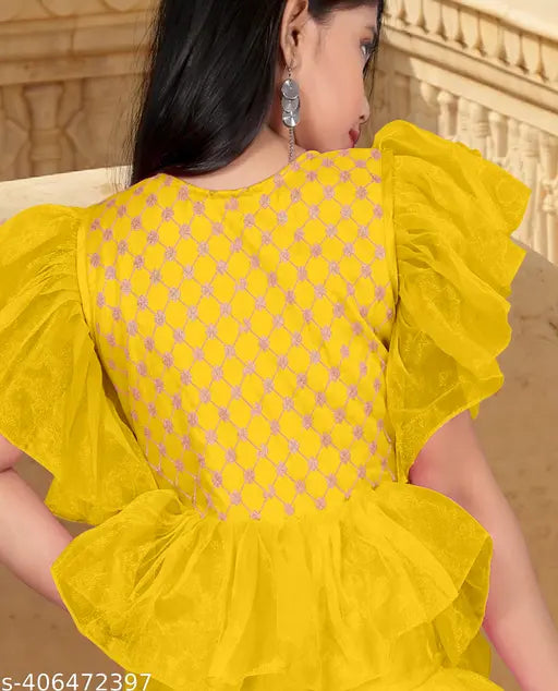Net embroidered ruffle gown by A. K. Enterprise, beaded and suitable for festive occasions. Available in various sizes from 5-16 years. Indian origin