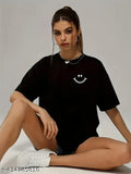 Black oversized cotton printed t-shirt for women and girls, featuring short sleeves and vibrant patterns. Made in India