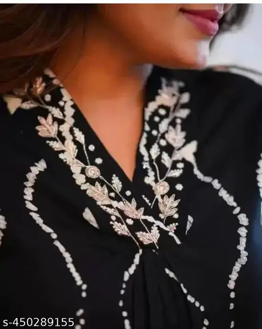 Tejas black handwork rayon kurta set with printed net palazzos, showcasing three-quarter sleeves on a model