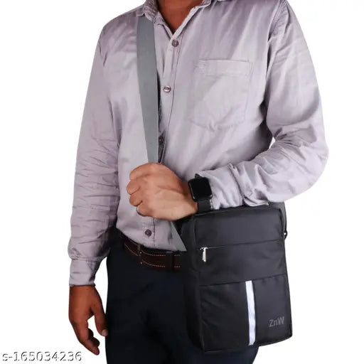 Black polyester sling bag, cross body style. Sleek and durable accessory for daily use. Solid net pattern, free size (9x7x3 inches). Made in India