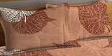 Brown leaf design double printed fitted Glace cotton bedsheet set with two pillow covers, ideal for summer sleep comfort