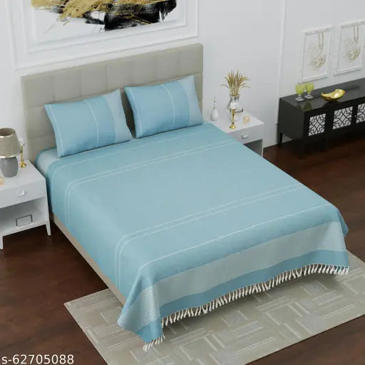 Luxurious handloom cotton double bedsheet in sky blue stripe design, includes 2 matching pillow covers, ideal for summer comfort and breathability
