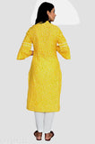 Yellow cotton A-line kurta with ethnic motif print, three-quarter sleeves, calf length, and side slits. Made from 100% rayon fabric, Jaipuri print originating from India