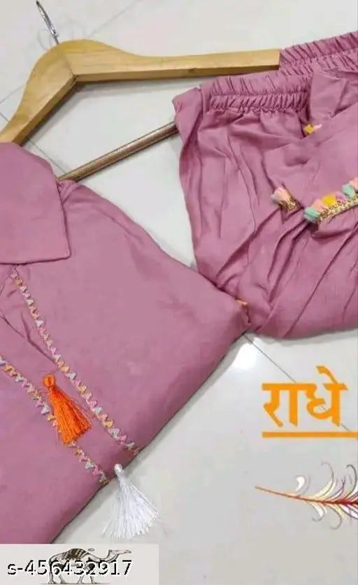 Party wear Women's printed & embroidered rayon A-line kurti with dhoti pant, knee length, v-neck, 3/4 sleeve, in traditional Indian style, with included necklace accessory