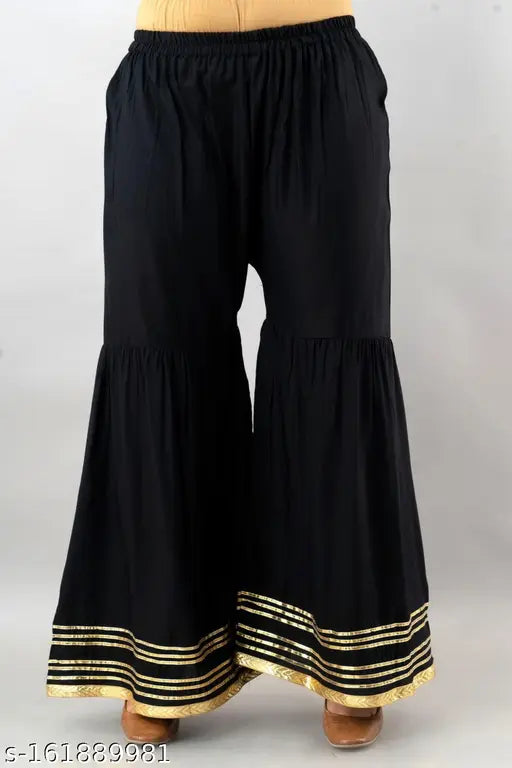 Women's viscose rayon kurta and sharara set in solid net, three-quarter sleeves. Indian clothing for women's fashion in sizes S-XXL
