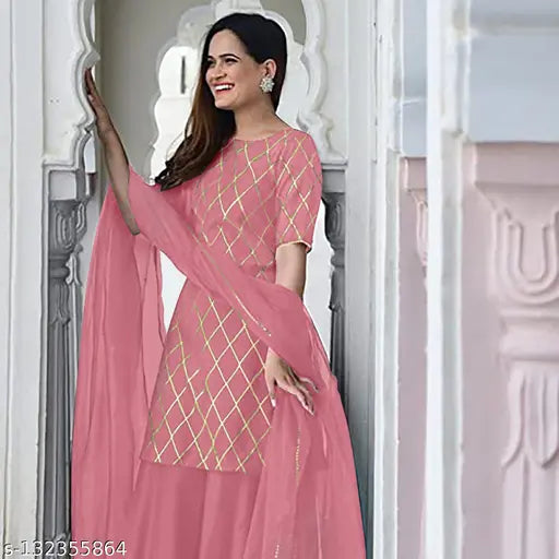 Peach rayon kurta set with net dupatta and sharara bottom wear, featuring three-quarter sleeves and printed design