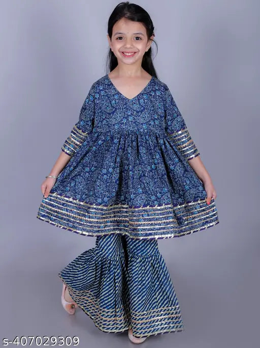 Navy blue cotton floral paisley print Anarkali/Flared Kurta & Sharara set for girls, featuring intricate embellishments and a flared silhouette. Perfect for special occasions or festive celebrations. Sizes: 2-3Y (20in), 3-4Y (22in), 4-5Y (24in), 5-6Y (26in), 6-7Y (28in), 7-8Y (30in), 9-10Y (32in), 11-12Y (34in), 13-14Y (36in). Made in India