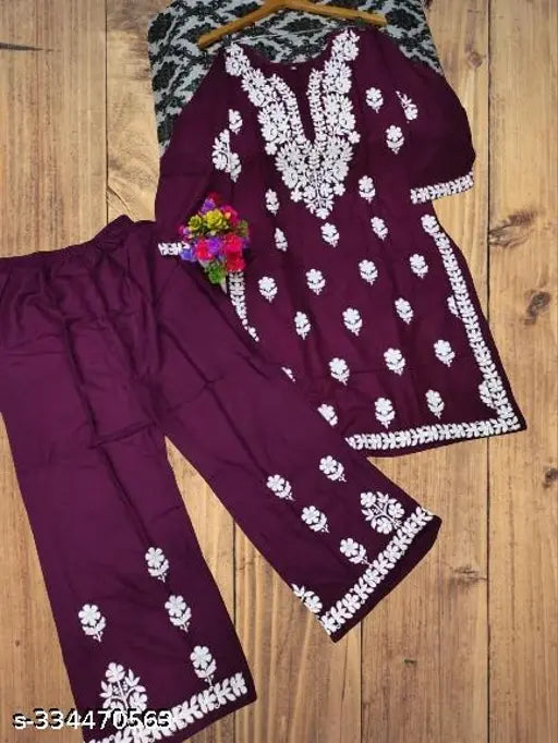 Embroidered rayon festive wear chikankari kurta with plazzo, three-quarter sleeves, Indian embroidery on display