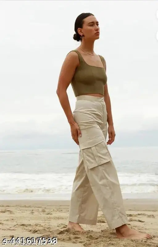 Cream cotton lycra women's cargo pants, high-rise with slanted inset pocket & patch, suitable for casual and formal wear