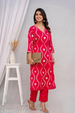 Pink rayon polka dot kurta for party wear, three-quarter sleeves, printed combo. Close-up on vibrant Indian fashion